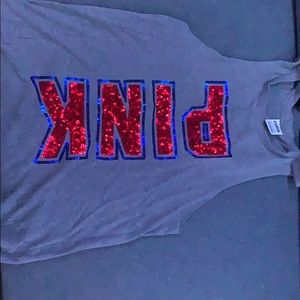 Size Xs fits more like a medium, pink tank top